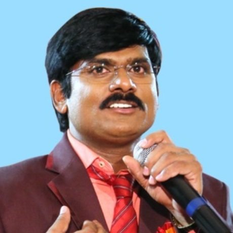 Vidya Ratna Dr. S. L. Narayana speaking into a microphone